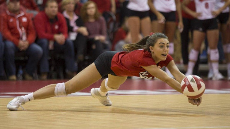 girl diving for a volleyball